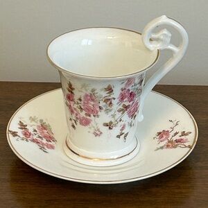GERMANY TEACUP AND SAUCER WITH ROSES PATTERN AND TRIMMED IN GOLD